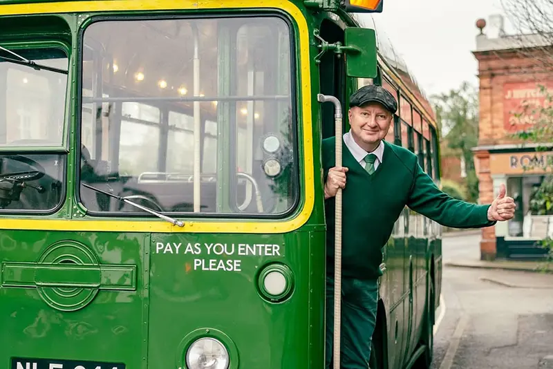 Owner, Richard Shirley, aboard the 1953 single deck green bus